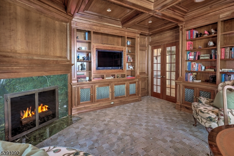 156 Overleigh Road Bernardsville, NJ 07924 - Photo 8 of 48 a living room with furniture a flat screen tv and a fireplace
