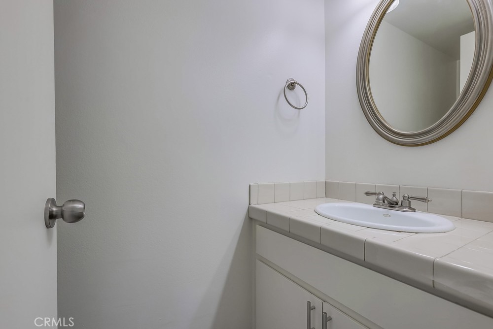 5429 Cajon Avenue Buena Park, CA 90621 - Photo 9 of 22 a bathroom with a sink and a mirror