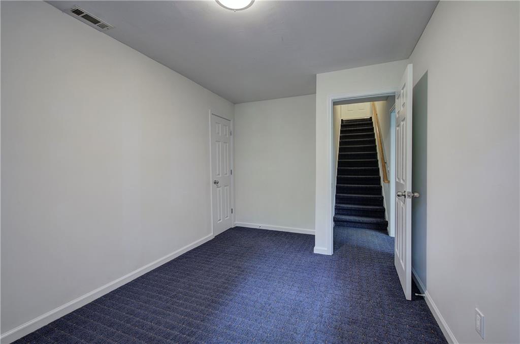 17 West Ridge Drive Southeast Cartersville, GA 30121 - Photo 26 of 37 a view of an empty room with wooden floor and a window