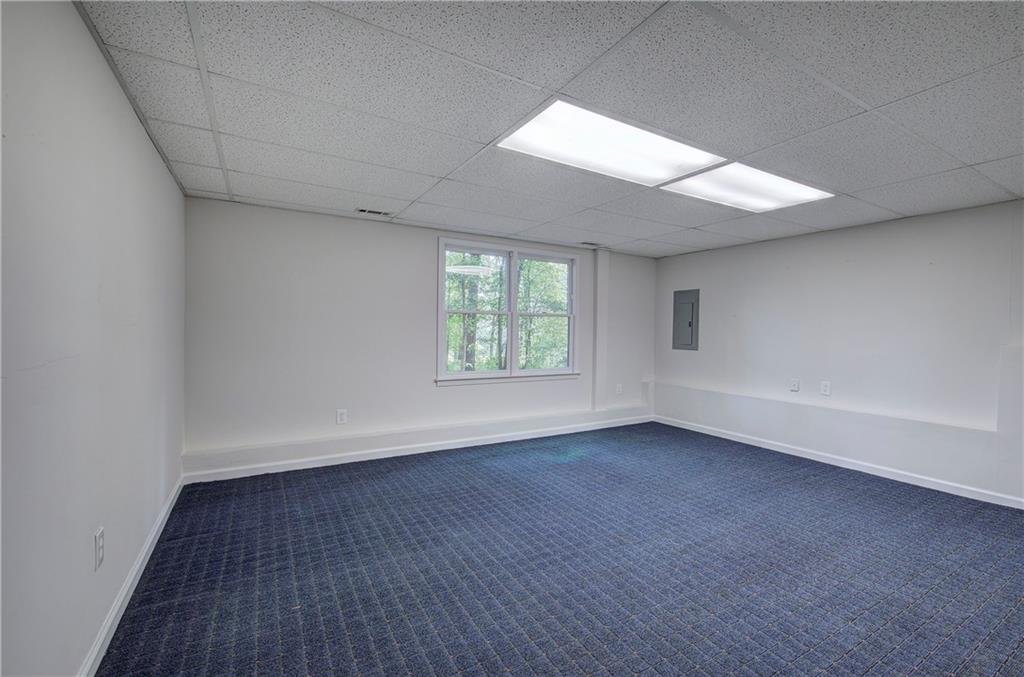 17 West Ridge Drive Southeast Cartersville, GA 30121 - Photo 27 of 37 an empty room with wooden floor and windows