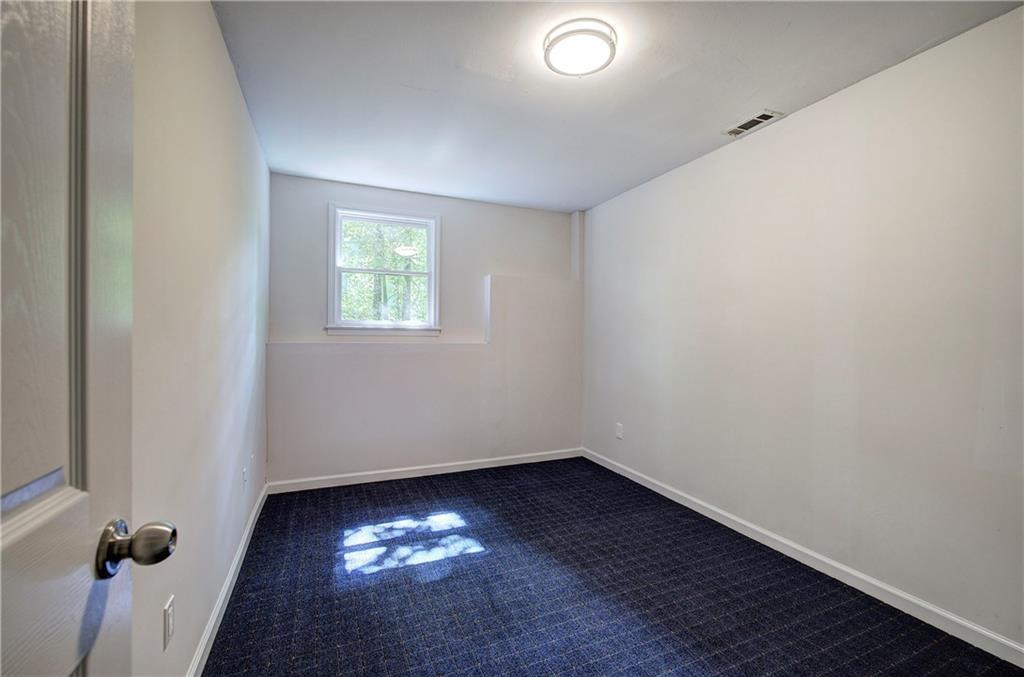 17 West Ridge Drive Southeast Cartersville, GA 30121 - Photo 28 of 37 an empty room with a window