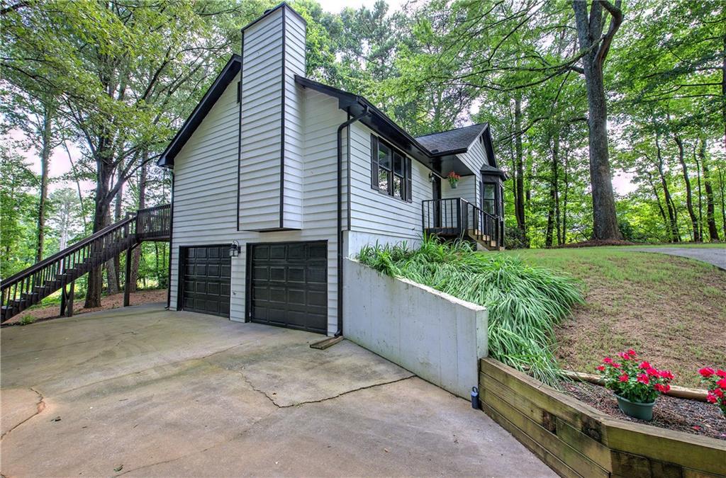 17 West Ridge Drive Southeast Cartersville, GA 30121 - Photo 3 of 37 a view of a house with a yard and potted plants