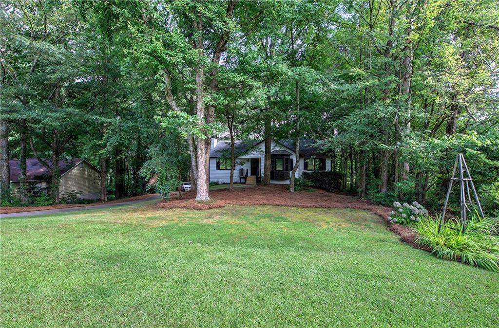 17 West Ridge Drive Southeast Cartersville, GA 30121 - Photo 6 of 37 a view of a house with backyard and a tree