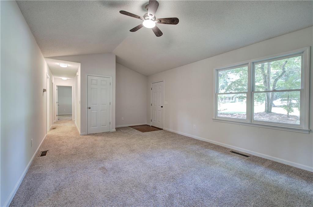 17 West Ridge Drive Southeast Cartersville, GA 30121 - Photo 10 of 37 a view of a livingroom with a ceiling fan and window