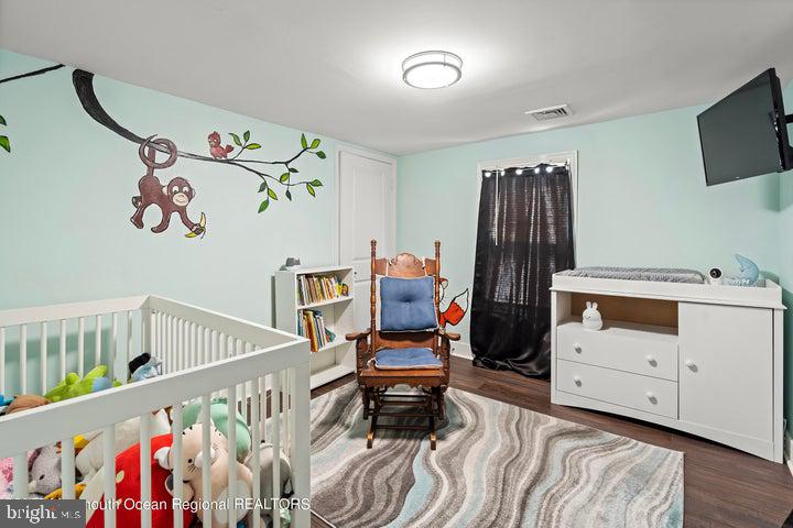 109 South Main Street Toms River, NJ 08757 - Photo 19 of 26 a bedroom with furniture and baby crib