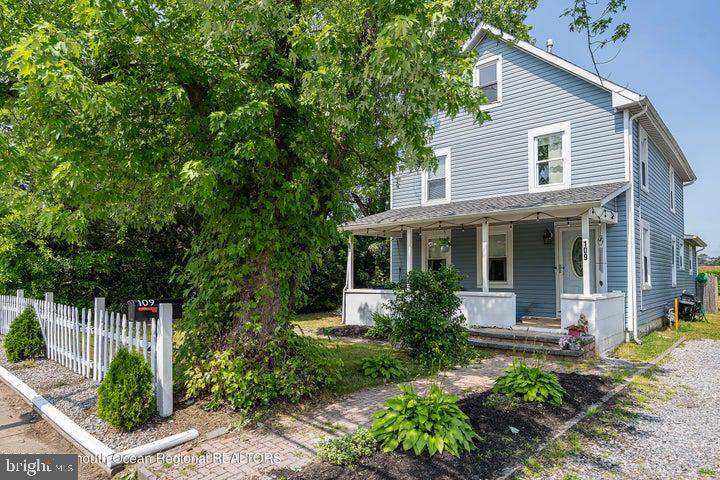 109 South Main Street Toms River, NJ 08757 - Photo 2 of 26 a front view of a house with a garden