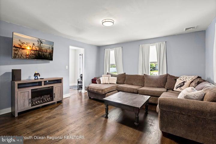 109 South Main Street Toms River, NJ 08757 - Photo 6 of 26 a living room with furniture and a flat screen tv