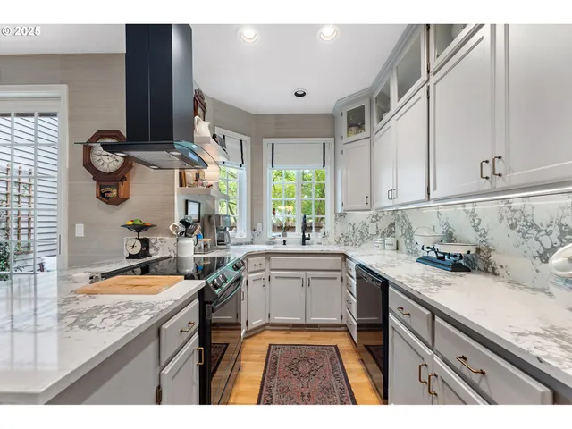 a kitchen with a sink stove and cabinets