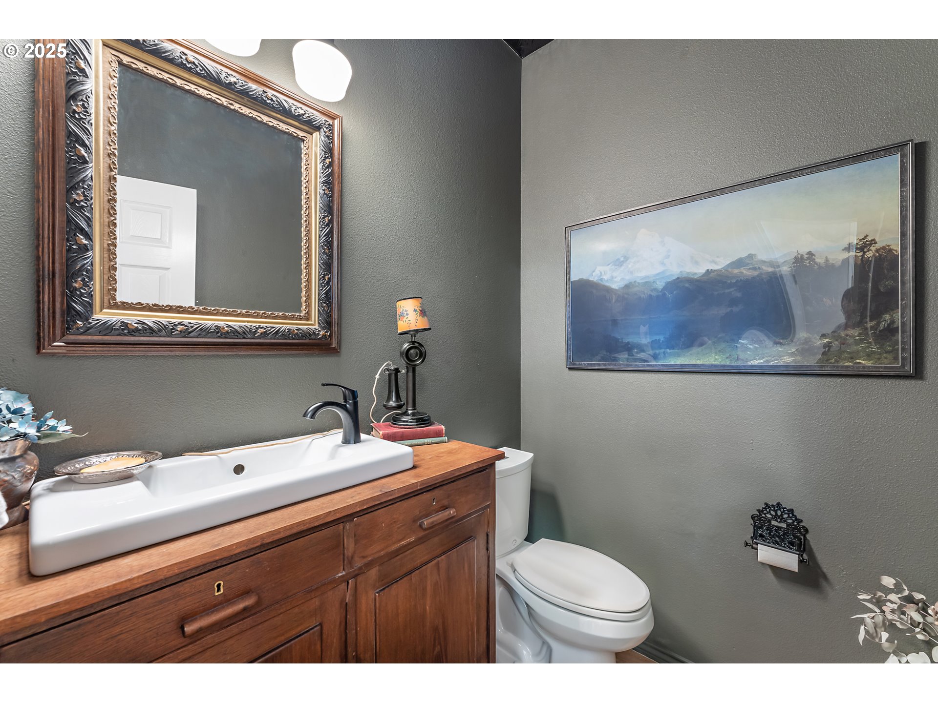 8200 Southwest Maxine Lane, Unit 59 Wilsonville, OR 97070 - Photo 18 of 33 a bathroom with a toilet a sink and mirror