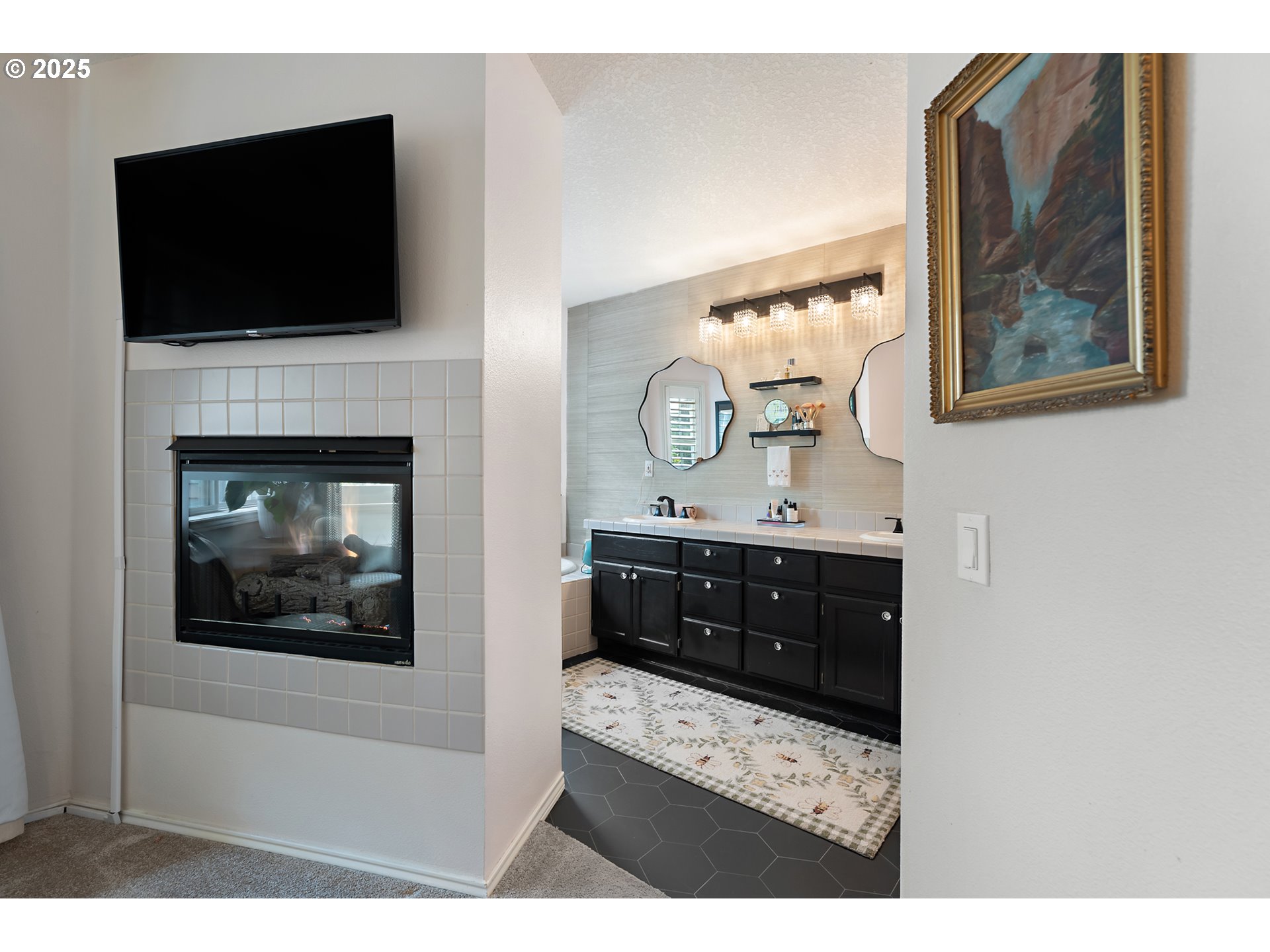 8200 Southwest Maxine Lane, Unit 59 Wilsonville, OR 97070 - Photo 20 of 33 a living room with a fireplace and a flat screen tv