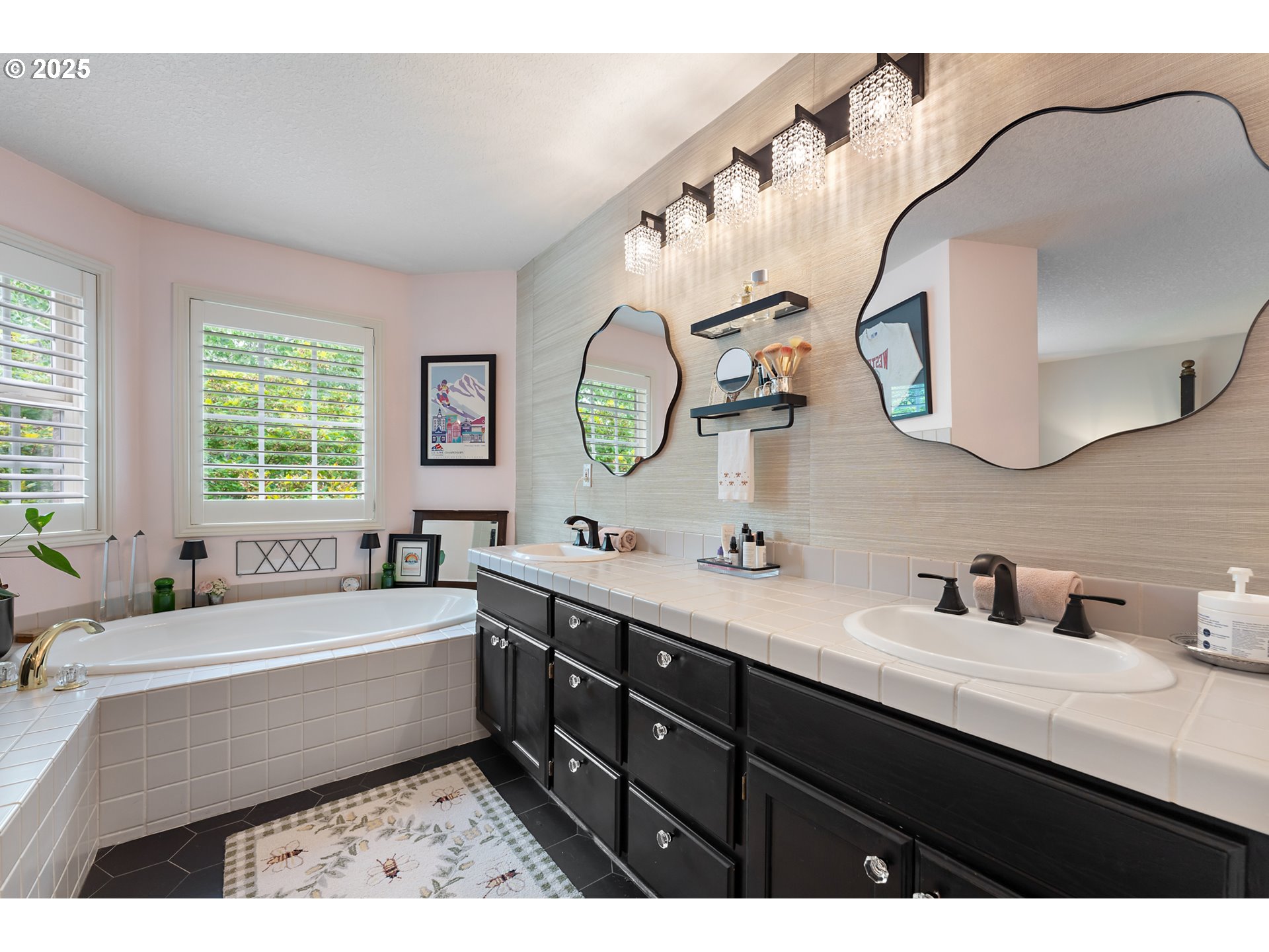 8200 Southwest Maxine Lane, Unit 59 Wilsonville, OR 97070 - Photo 21 of 33 a bathroom with a double vanity sink and a mirror
