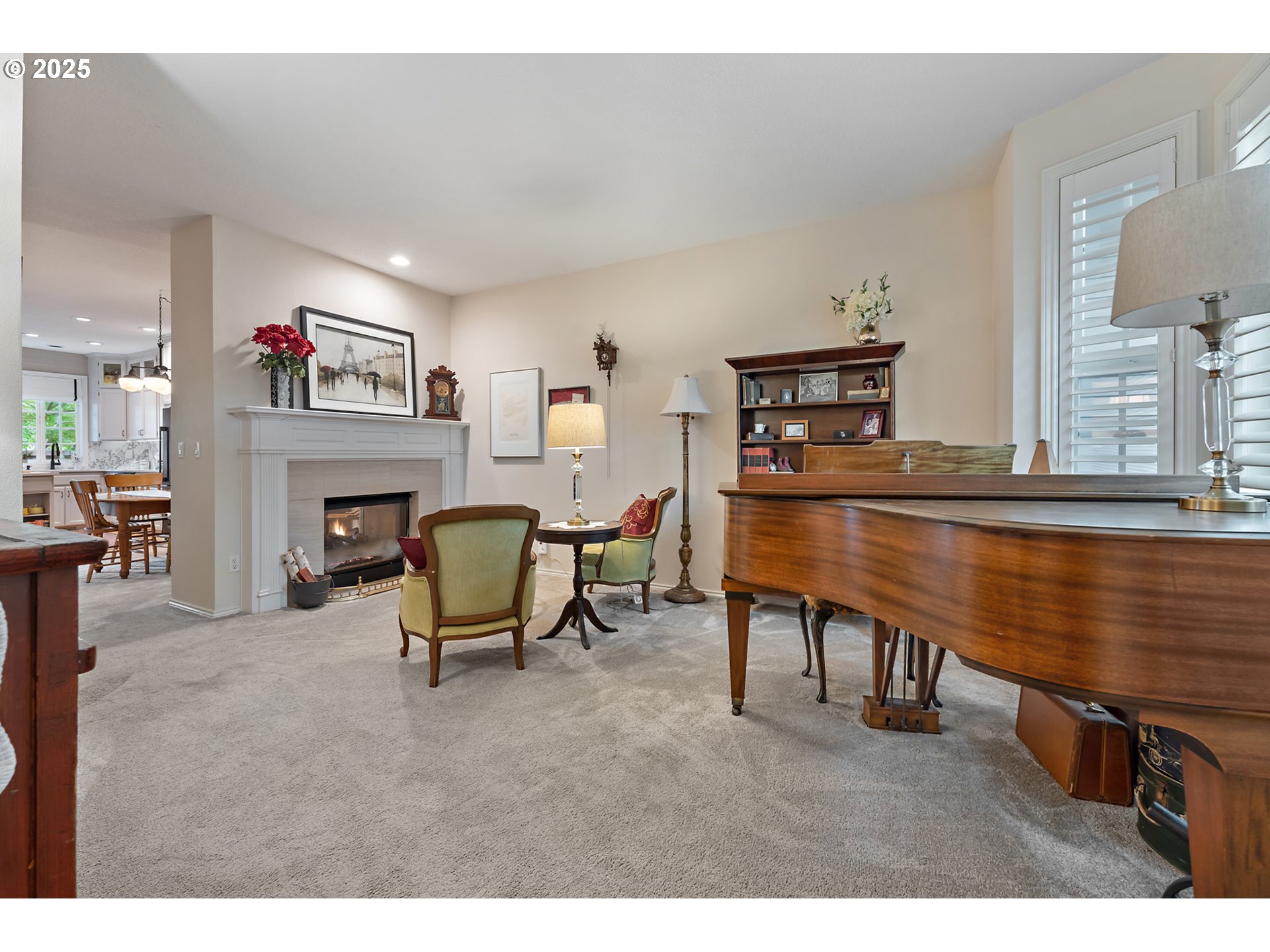 8200 Southwest Maxine Lane, Unit 59 Wilsonville, OR 97070 - Photo 4 of 33 a living room with furniture a fireplace and a large window