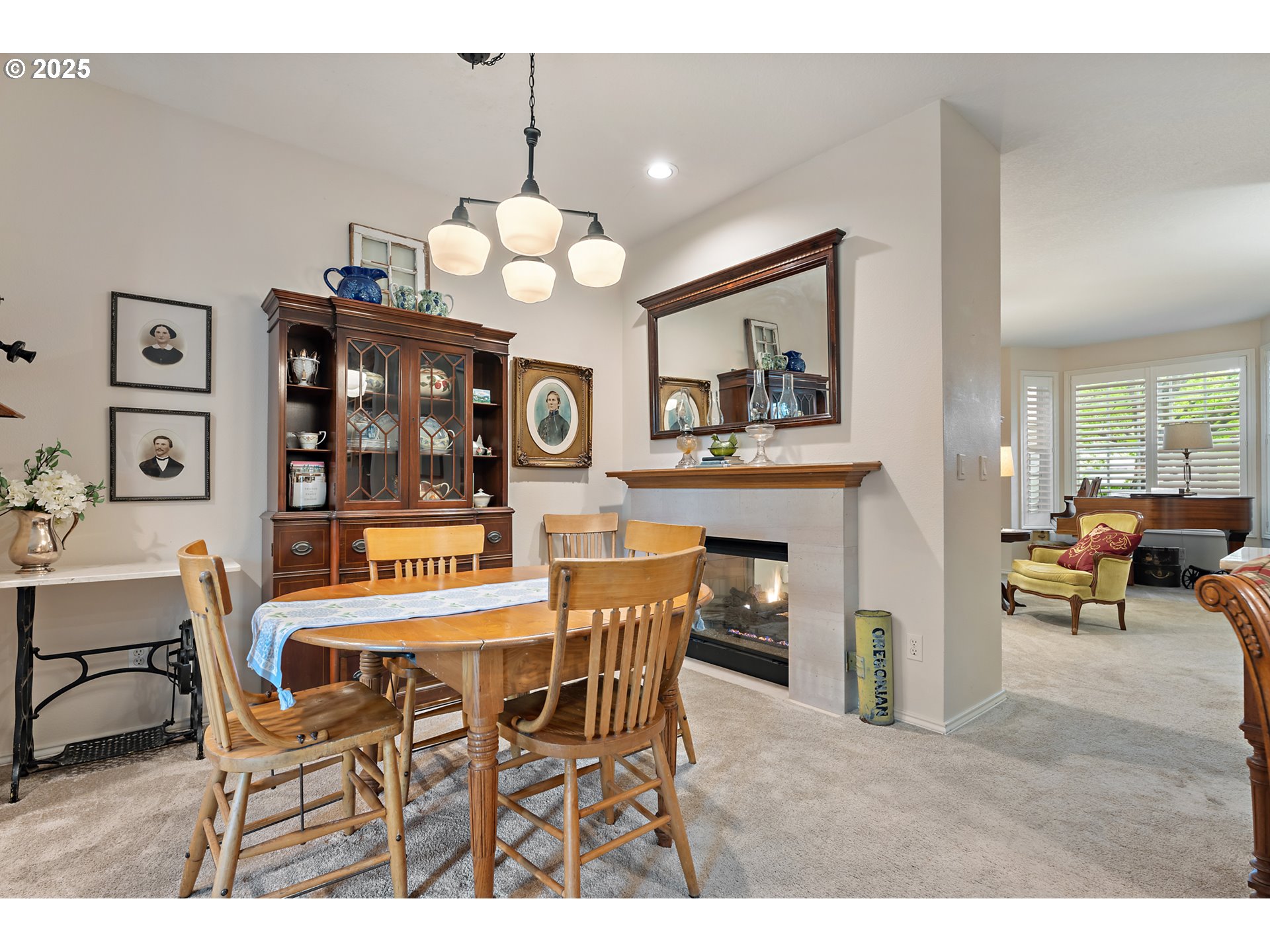 8200 Southwest Maxine Lane, Unit 59 Wilsonville, OR 97070 - Photo 8 of 33 a view of a dining room with furniture and chandelier
