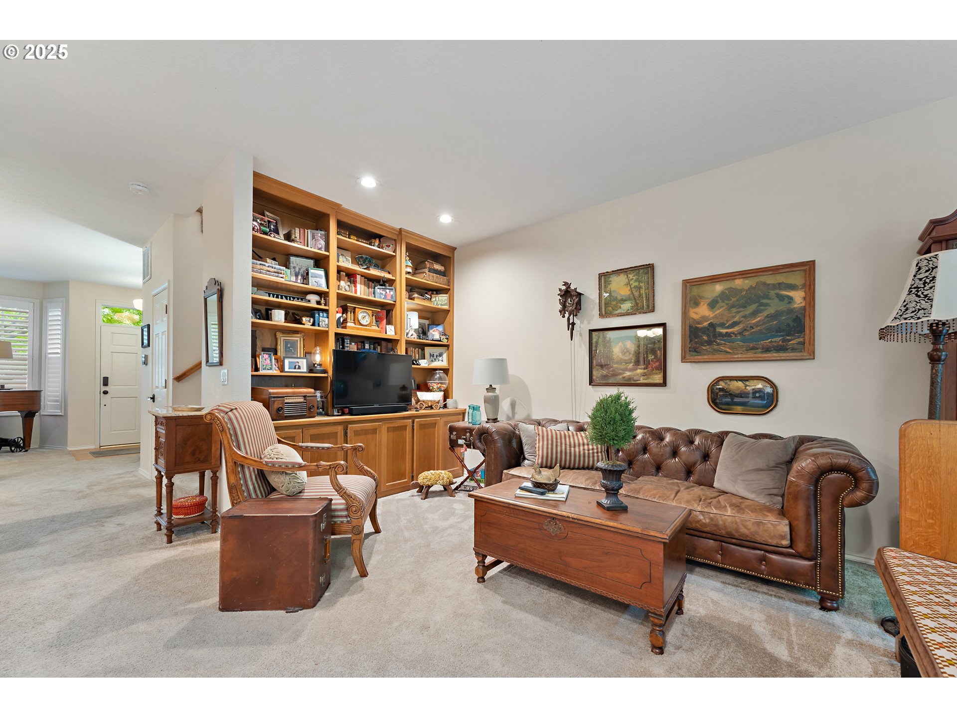 8200 Southwest Maxine Lane, Unit 59 Wilsonville, OR 97070 - Photo 10 of 33 a living room with furniture and a book shelf