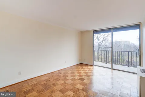 a view of an empty room with a window