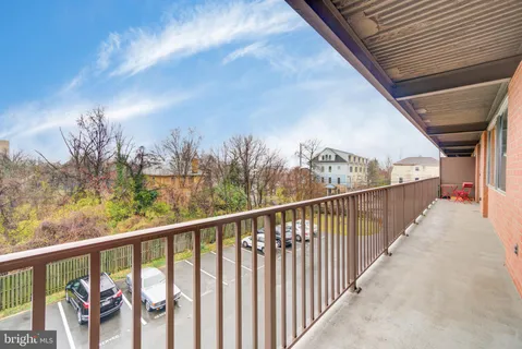 a view of a balcony with furniture
