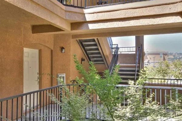 a view of balcony with furniture