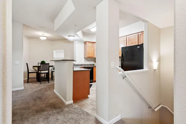 a view of living room with furniture and flat screen tv