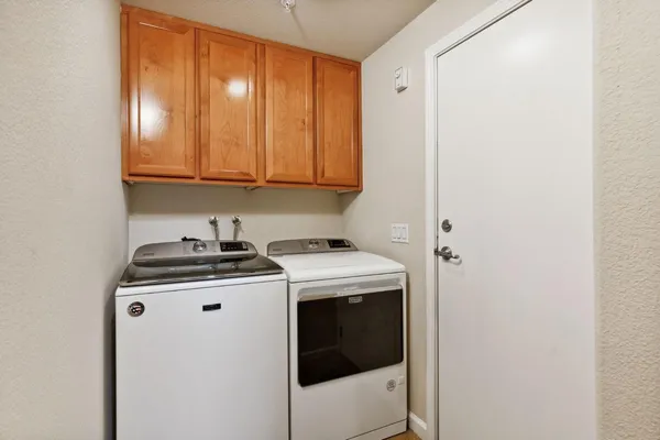 a kitchen with a stove and a window