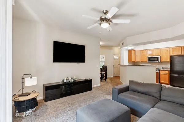 a living room with furniture and a flat screen tv