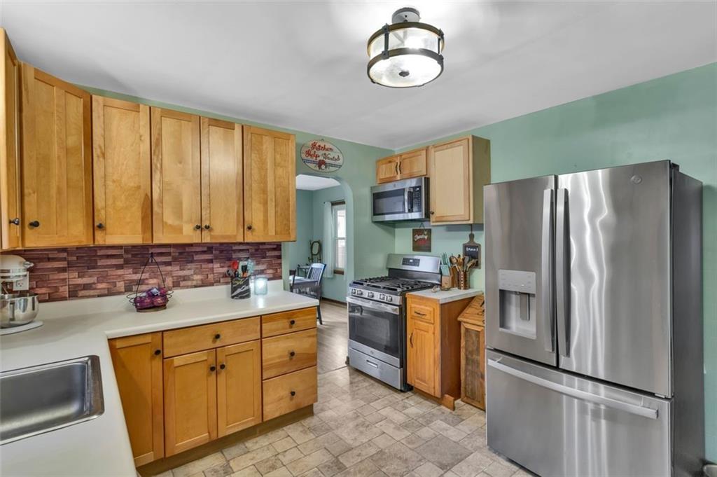 634 Rose Street Apollo, PA 15613 - Photo 13 of 29 a kitchen with cabinets stainless steel appliances and a window