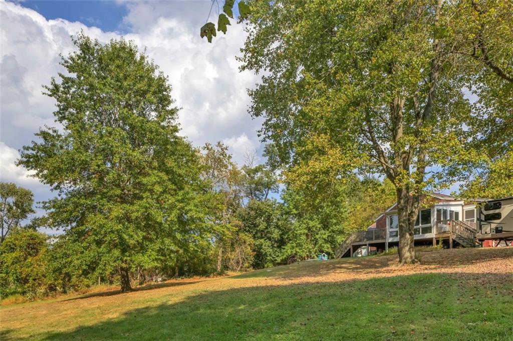 634 Rose Street Apollo, PA 15613 - Photo 29 of 29 a view of a house with a big yard and large trees