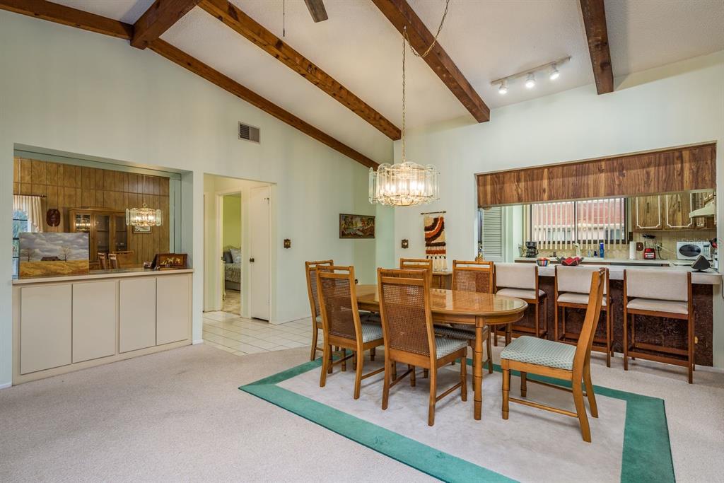 9910 Eagles Point Circle, Unit 3 Port Richey, FL 34668 - Photo 11 of 25 a view of a dining room with furniture