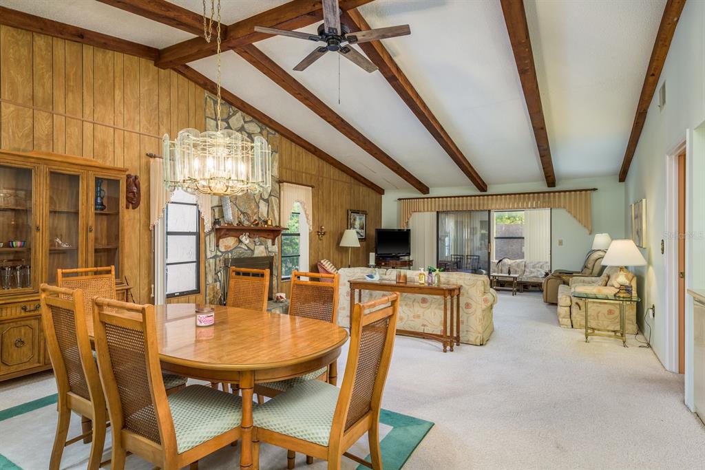 9910 Eagles Point Circle, Unit 3 Port Richey, FL 34668 - Photo 6 of 25 a dining room with furniture window and outside view