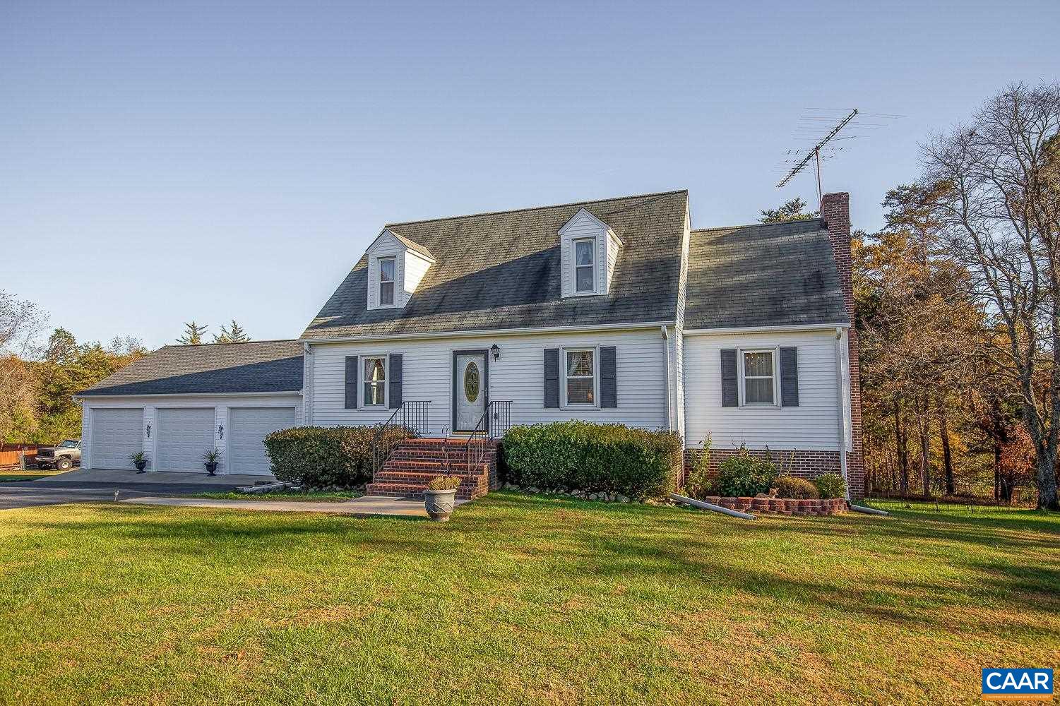 3248 Welsh Run Road Ruckersville, VA 22968 - Photo 1 of 43 a front view of house with yard and outdoor seating