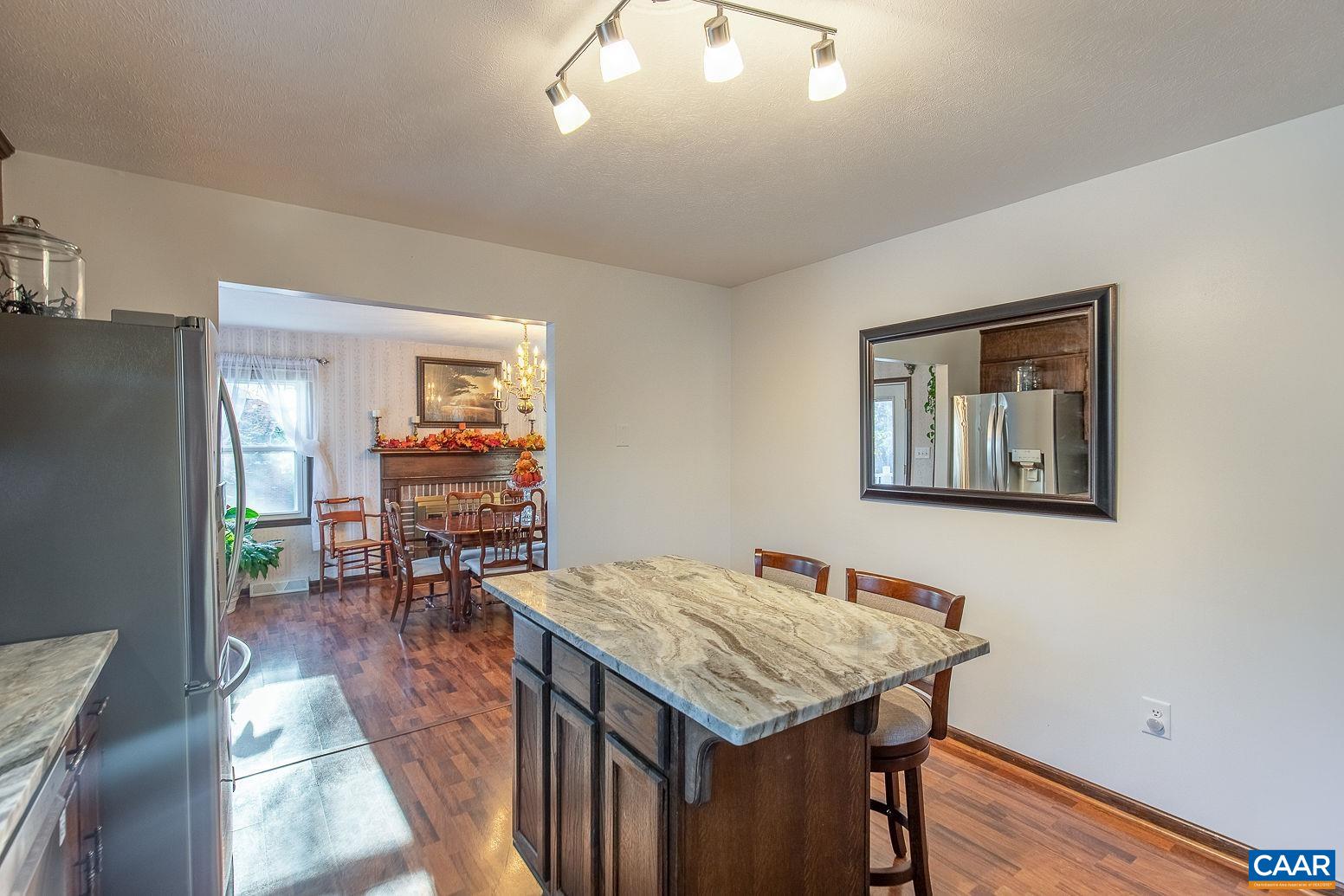 3248 Welsh Run Road Ruckersville, VA 22968 - Photo 13 of 43 a kitchen that has a table and chairs in it