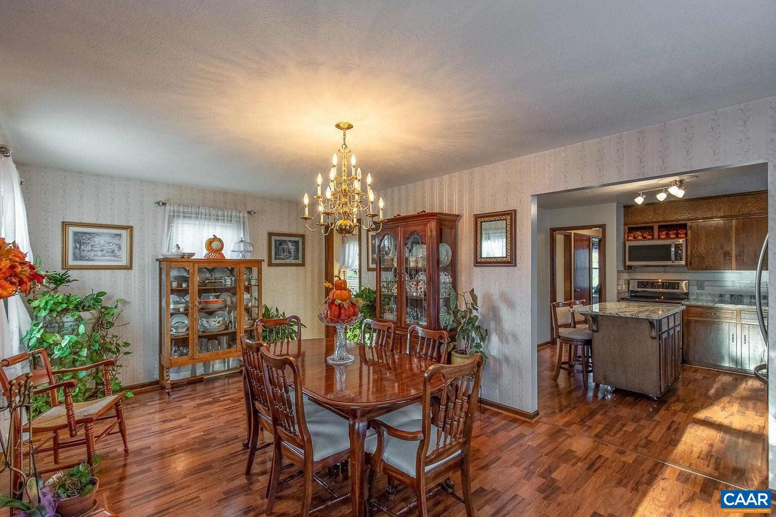 3248 Welsh Run Road Ruckersville, VA 22968 - Photo 14 of 43 a view of a dining room with furniture and wooden floor
