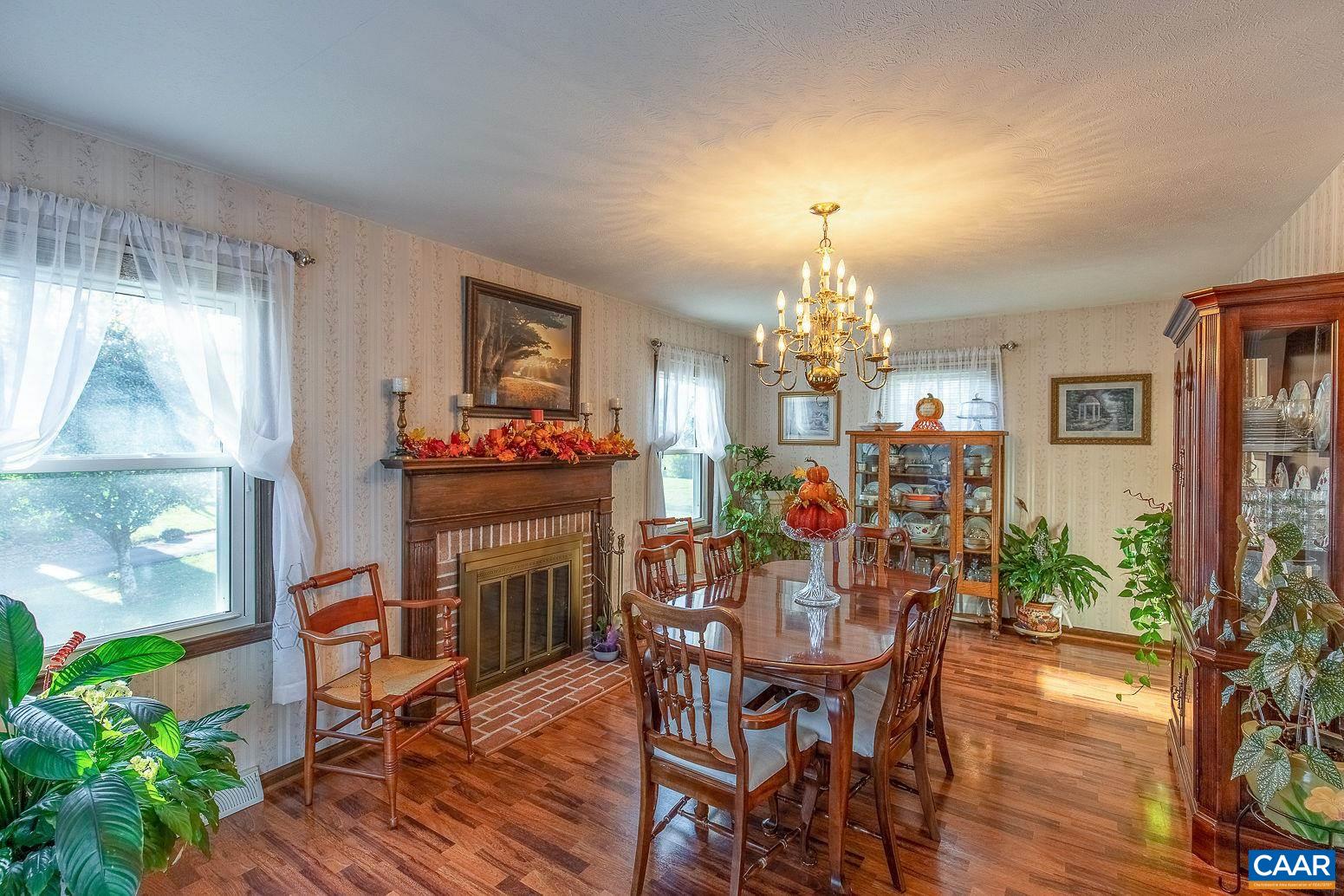 3248 Welsh Run Road Ruckersville, VA 22968 - Photo 15 of 43 a view of a dining room with furniture and chandelier