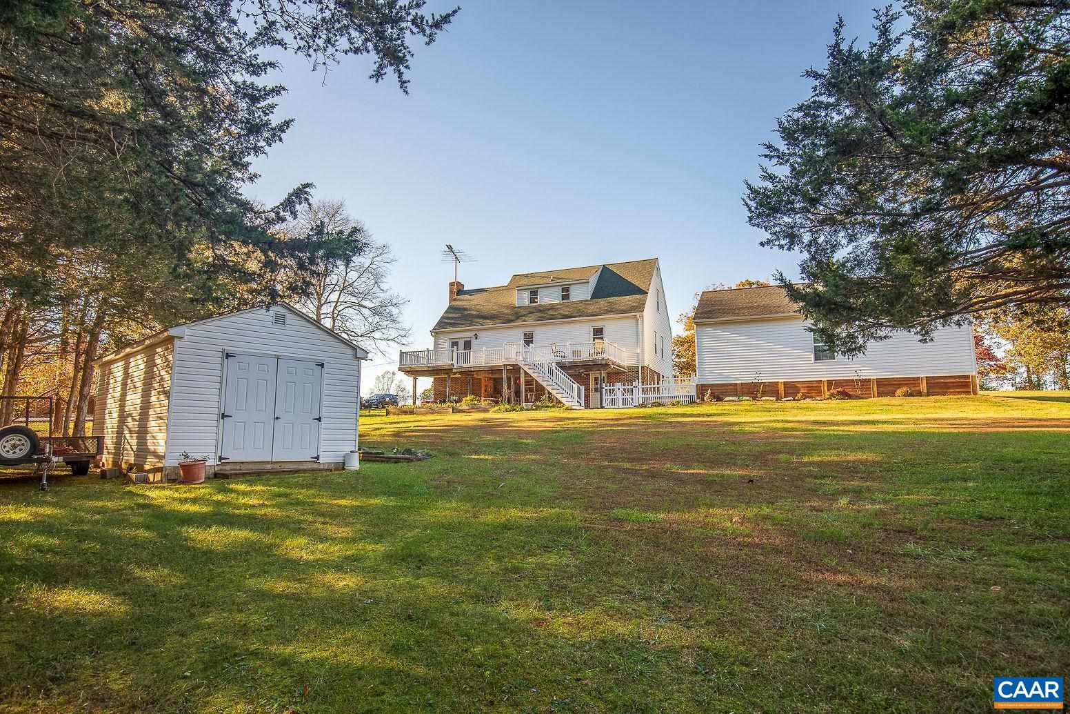 3248 Welsh Run Road Ruckersville, VA 22968 - Photo 38 of 43 a view of a house with a big yard and large trees