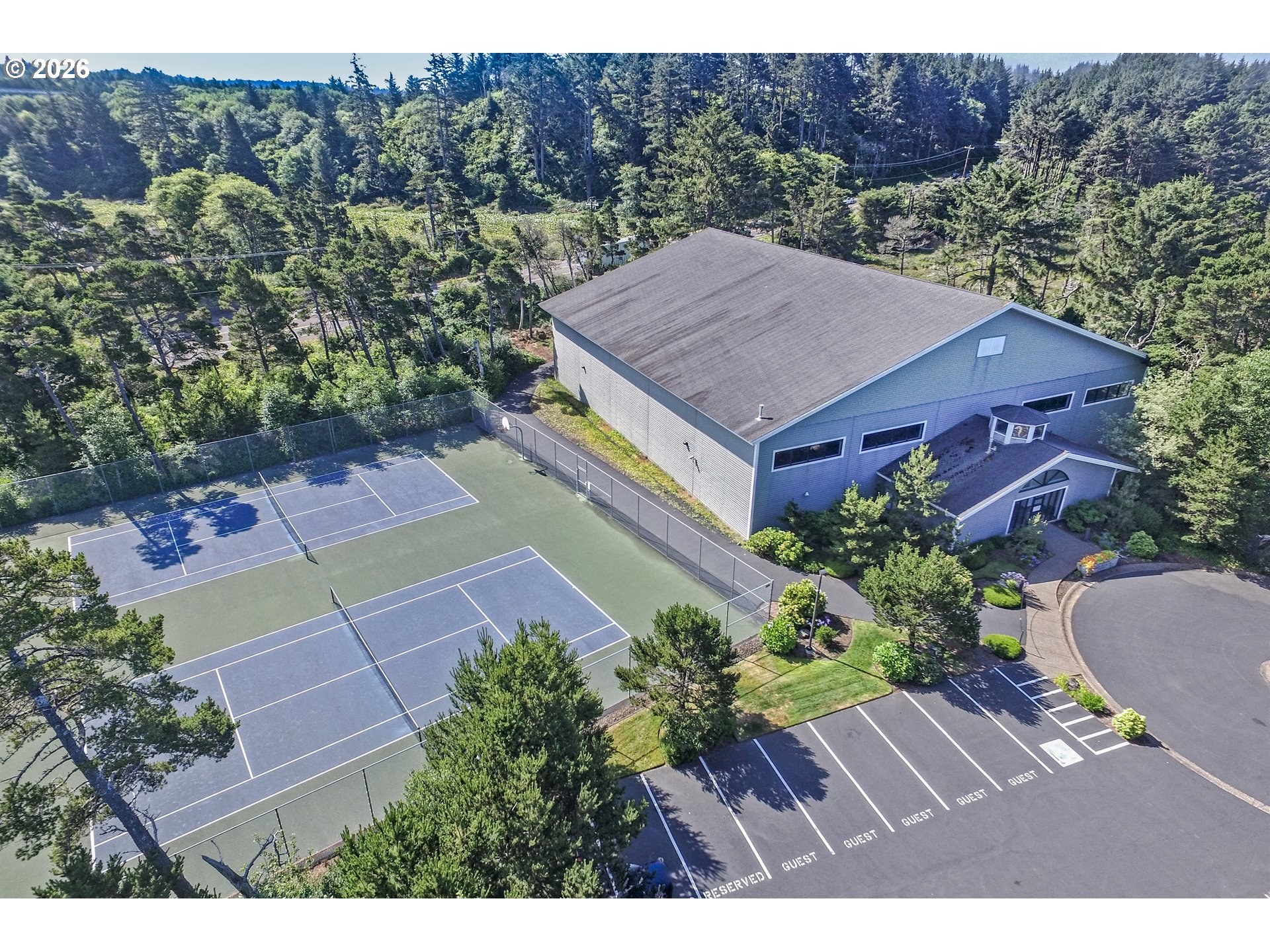 Southwest 61st Street, Unit 7300 South Beach, OR 97366 - Photo 18 of 26 an aerial view of a house with a garden