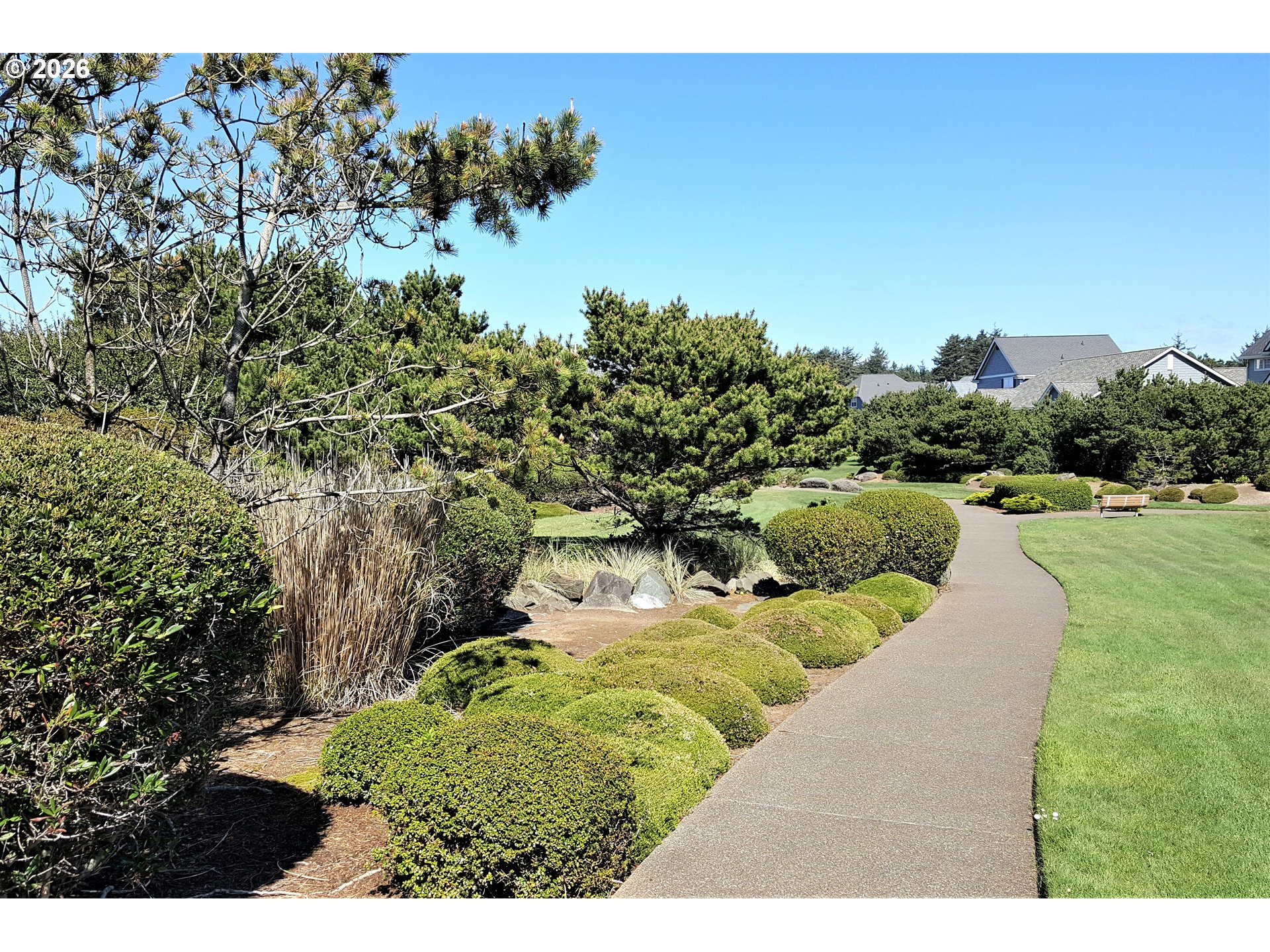 Southwest 61st Street, Unit 7300 South Beach, OR 97366 - Photo 20 of 26 a view of a swimming pool with a yard