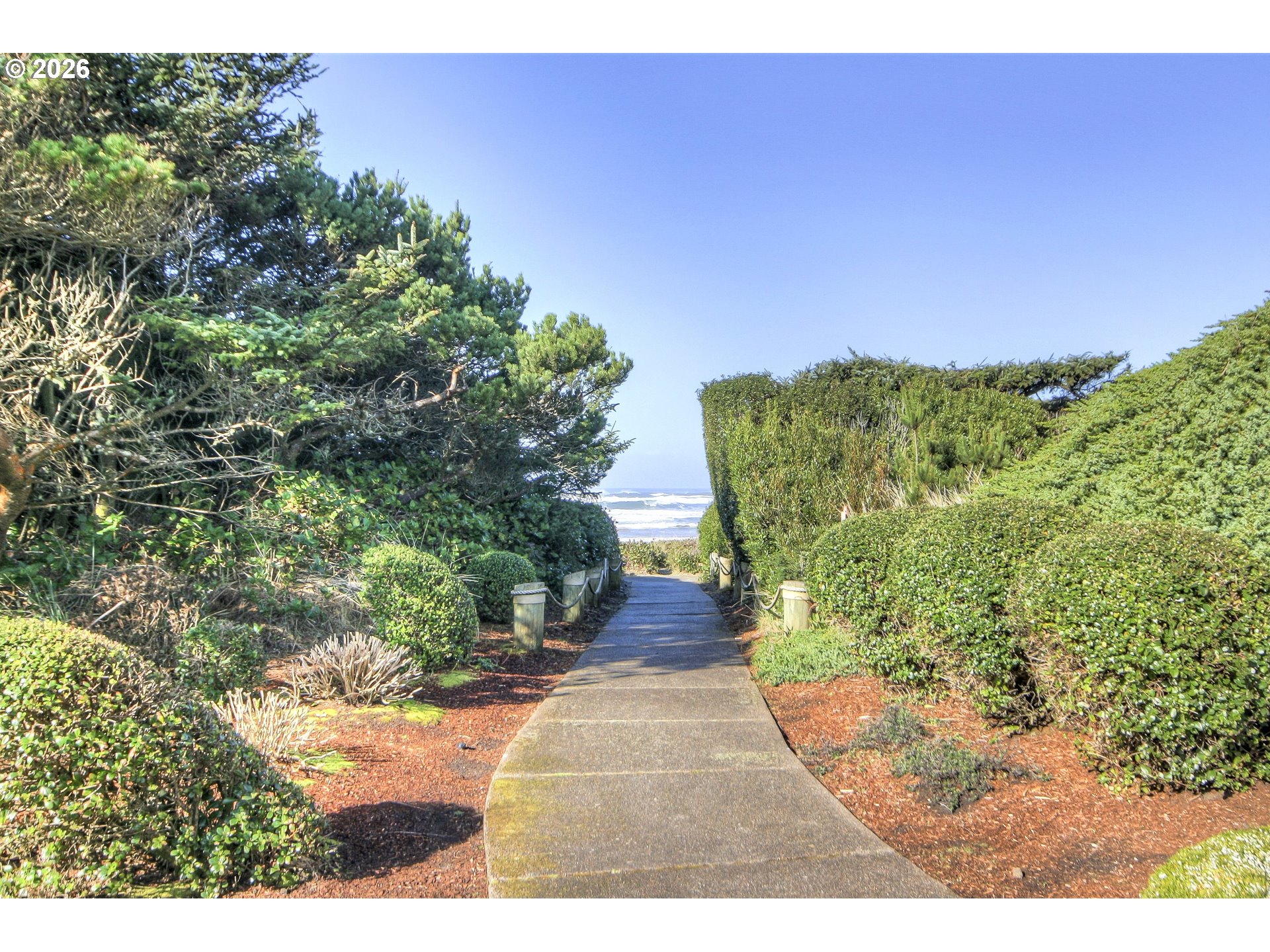 Southwest 61st Street, Unit 7300 South Beach, OR 97366 - Photo 23 of 26 a view of a garden