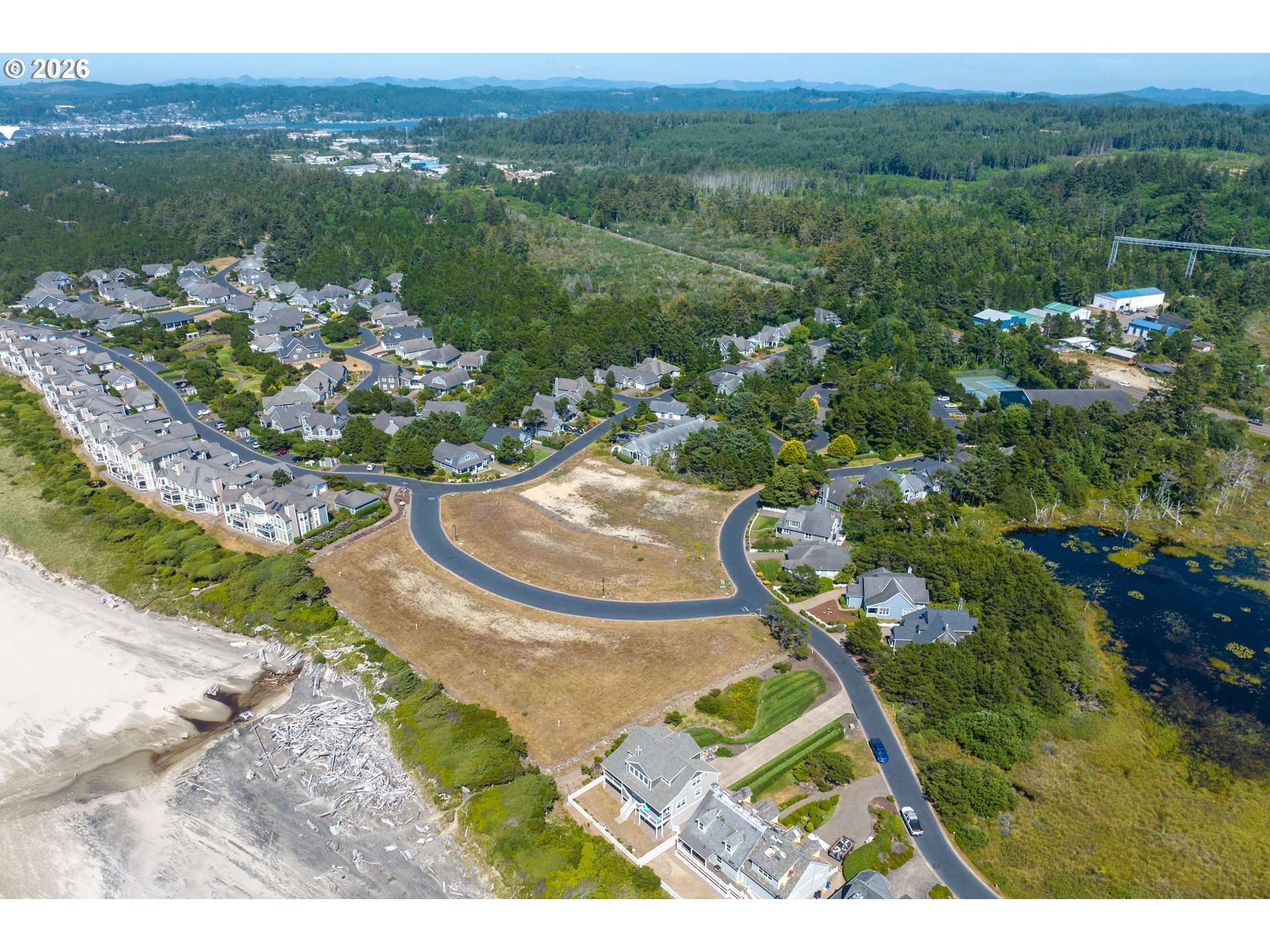Southwest 61st Street, Unit 7300 South Beach, OR 97366 - Photo 7 of 26 a view of a lake with a mountain in the background