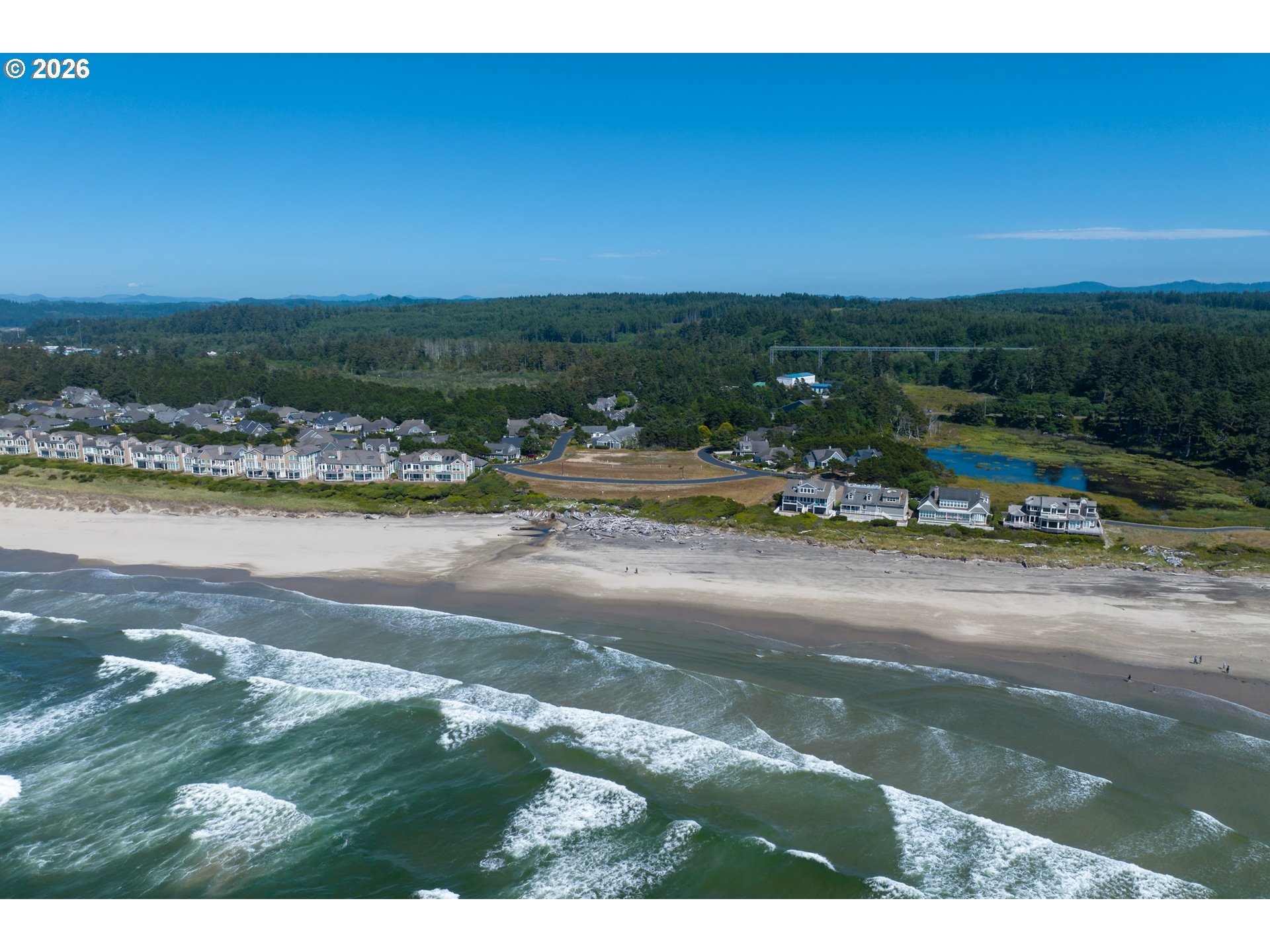 Southwest 61st Street, Unit 7300 South Beach, OR 97366 - Photo 10 of 26 a view of a lake with beach and city