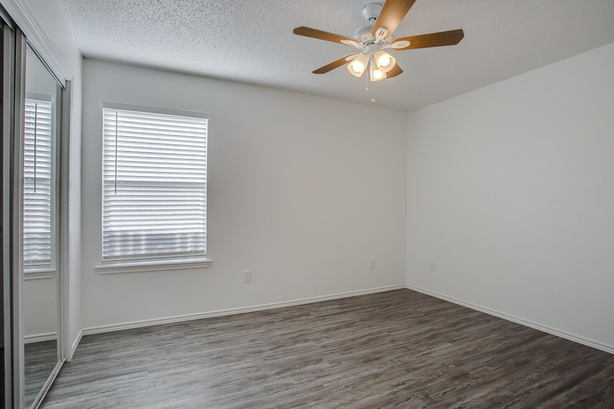 2514 108th Drive Lubbock, TX 79423 - Photo 15 of 16 wooden floor in an empty room with a window