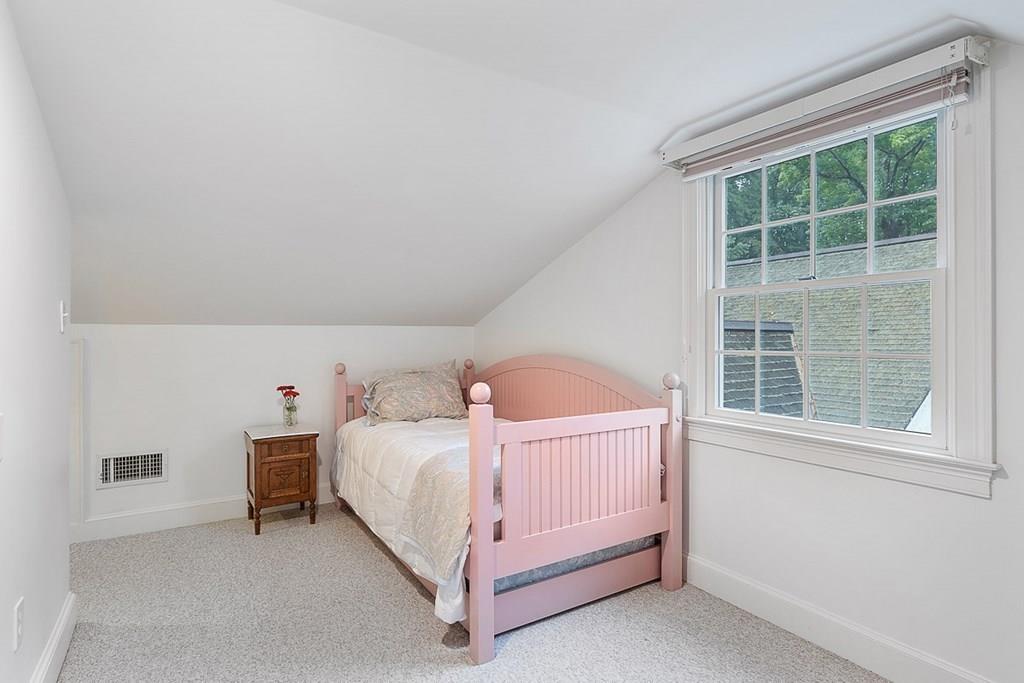 18 Wheeler Road Lincoln, MA 01773 - Photo 22 of 42 a bedroom with a bed and a window