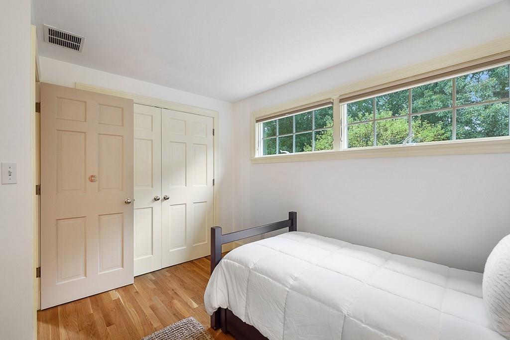 18 Wheeler Road Lincoln, MA 01773 - Photo 23 of 42 a bedroom with a bed and a window