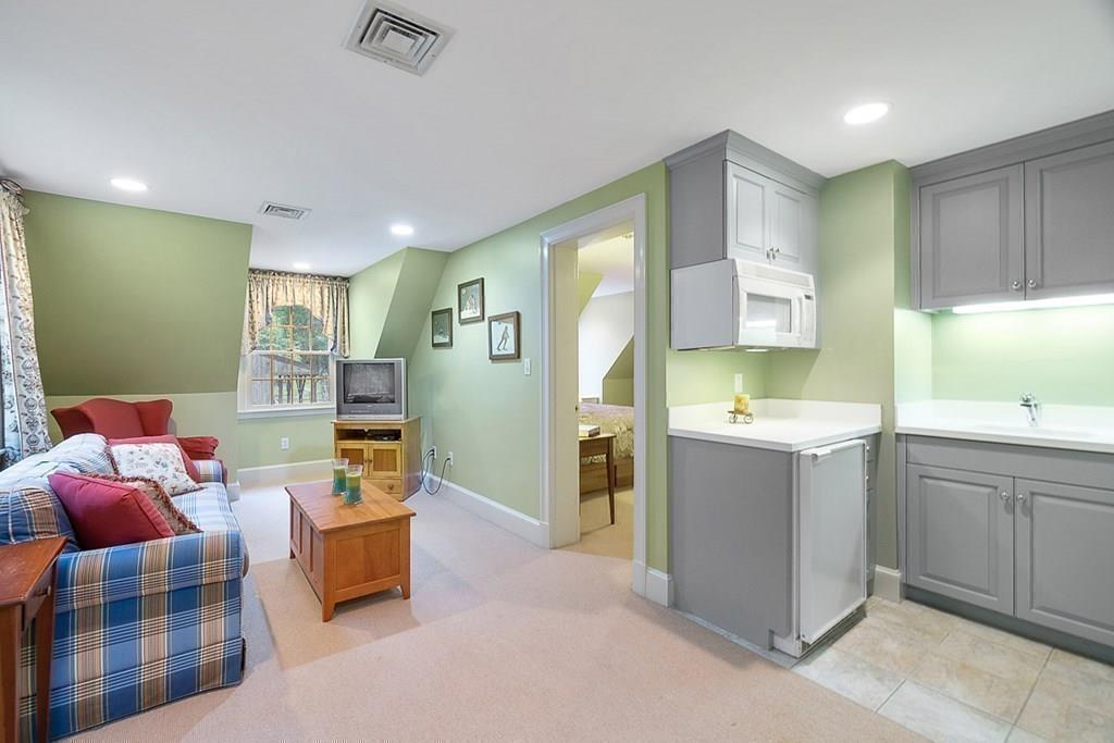 18 Wheeler Road Lincoln, MA 01773 - Photo 26 of 42 a kitchen with white cabinets and sink