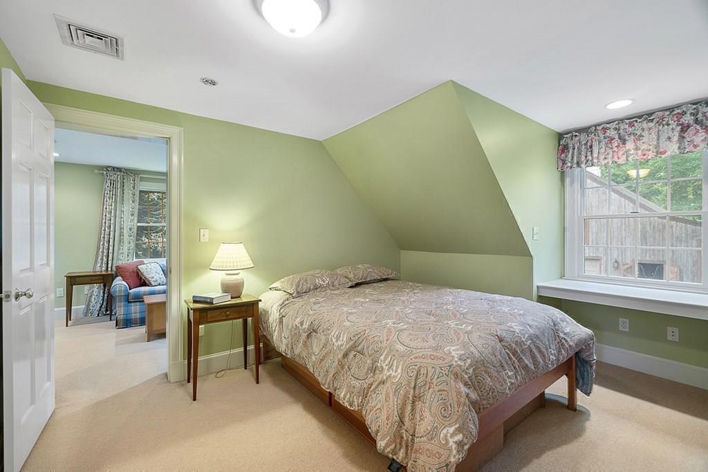 18 Wheeler Road Lincoln, MA 01773 - Photo 27 of 42 a bedroom with a bed and a table
