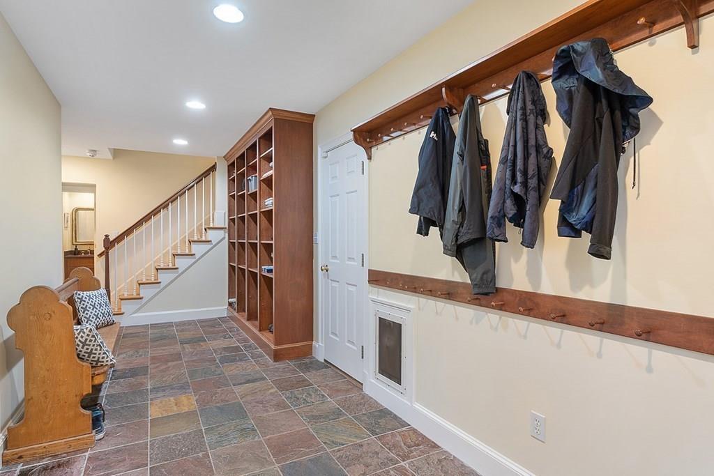18 Wheeler Road Lincoln, MA 01773 - Photo 31 of 42 a hallway with white walls and stairs