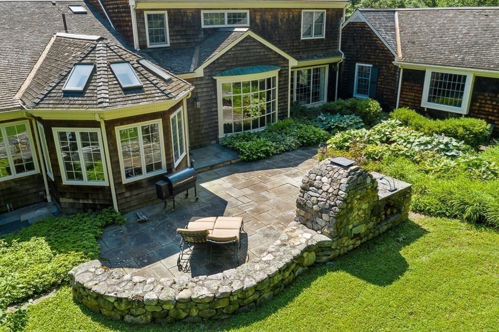 18 Wheeler Road Lincoln, MA 01773 - Photo 34 of 42 a view of a house with a yard porch and sitting area