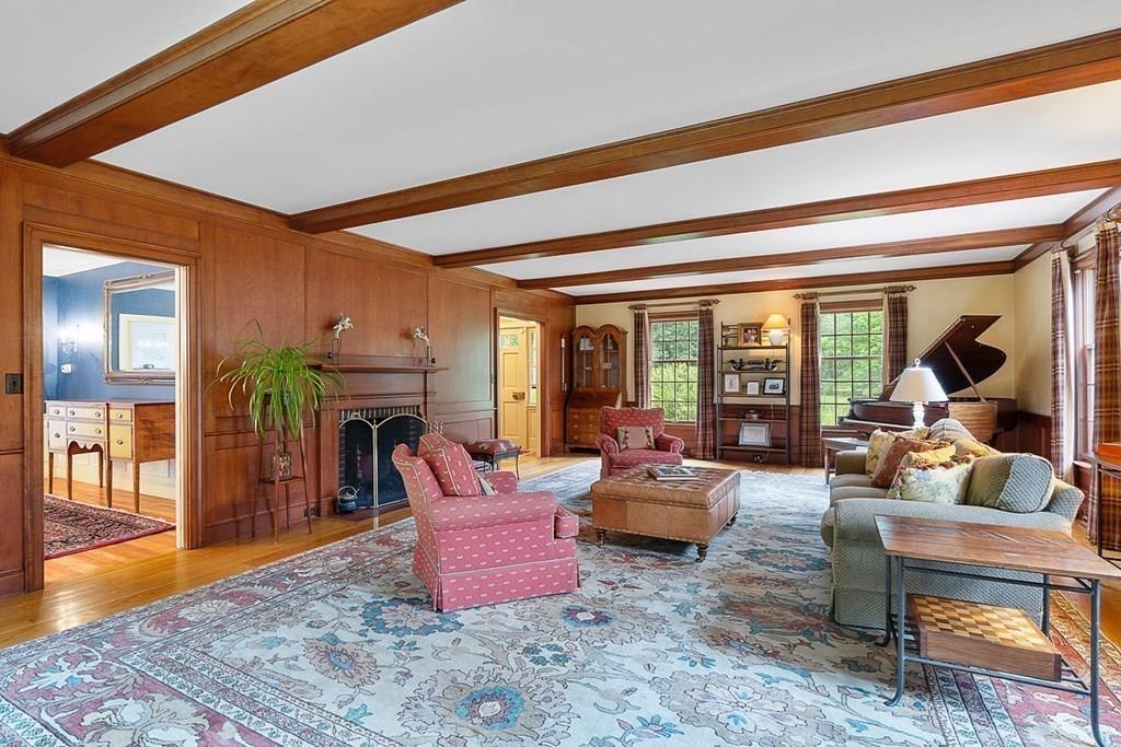 18 Wheeler Road Lincoln, MA 01773 - Photo 5 of 42 a living room with furniture a dining table and chairs with floor to ceiling window