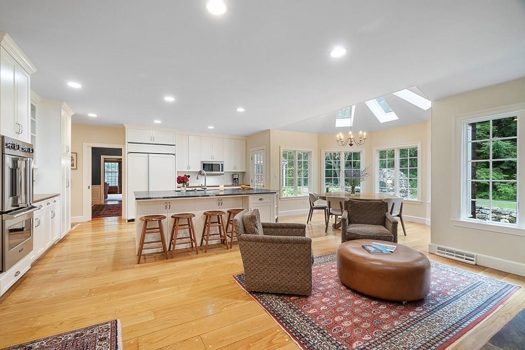 18 Wheeler Road Lincoln, MA 01773 - Photo 10 of 42 a living room with furniture and a table