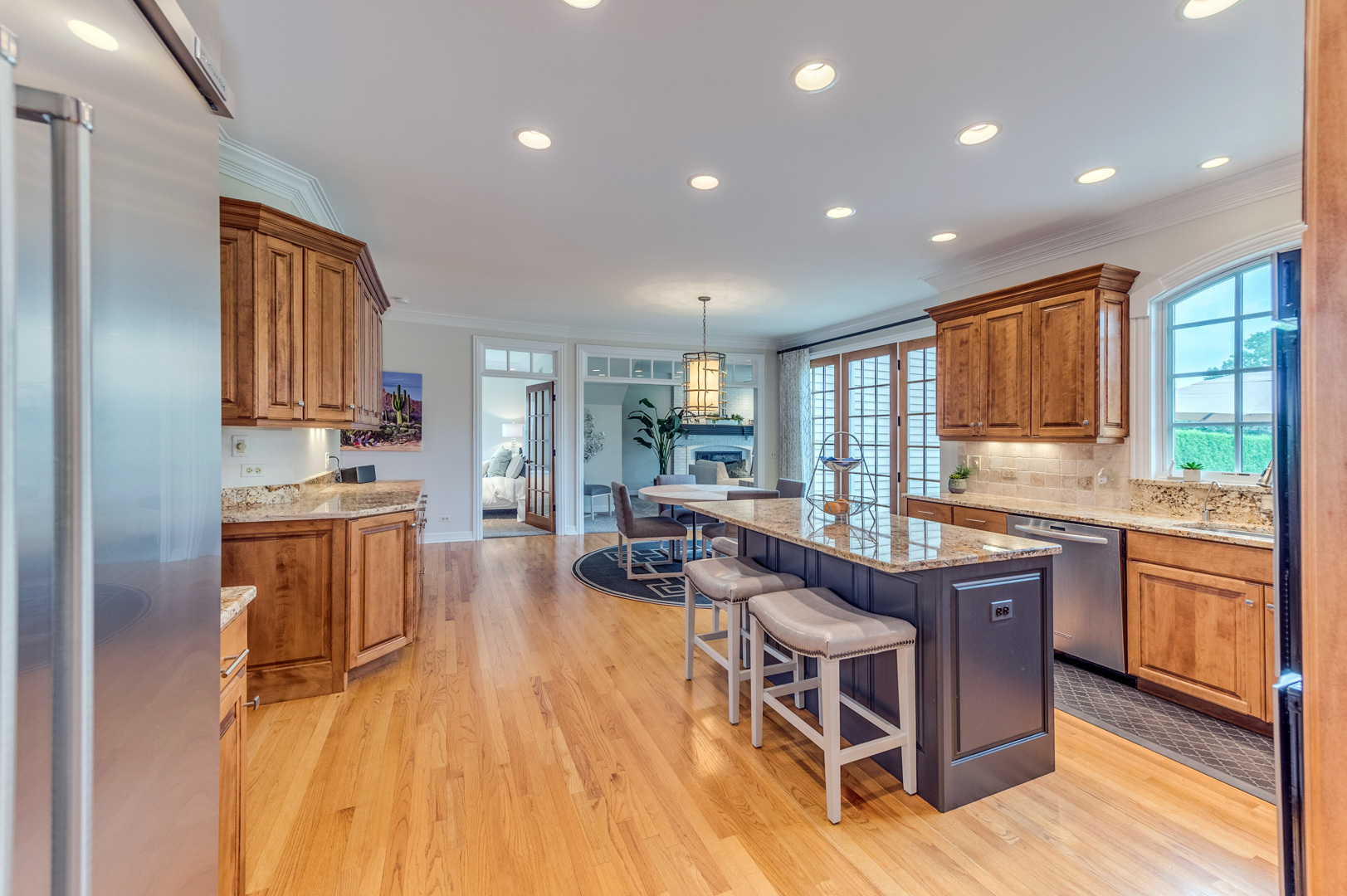 1009 Sutton Place St. Charles, IL 60174 - Photo 12 of 41 a kitchen with granite countertop lots of counter top space and stainless steel appliances