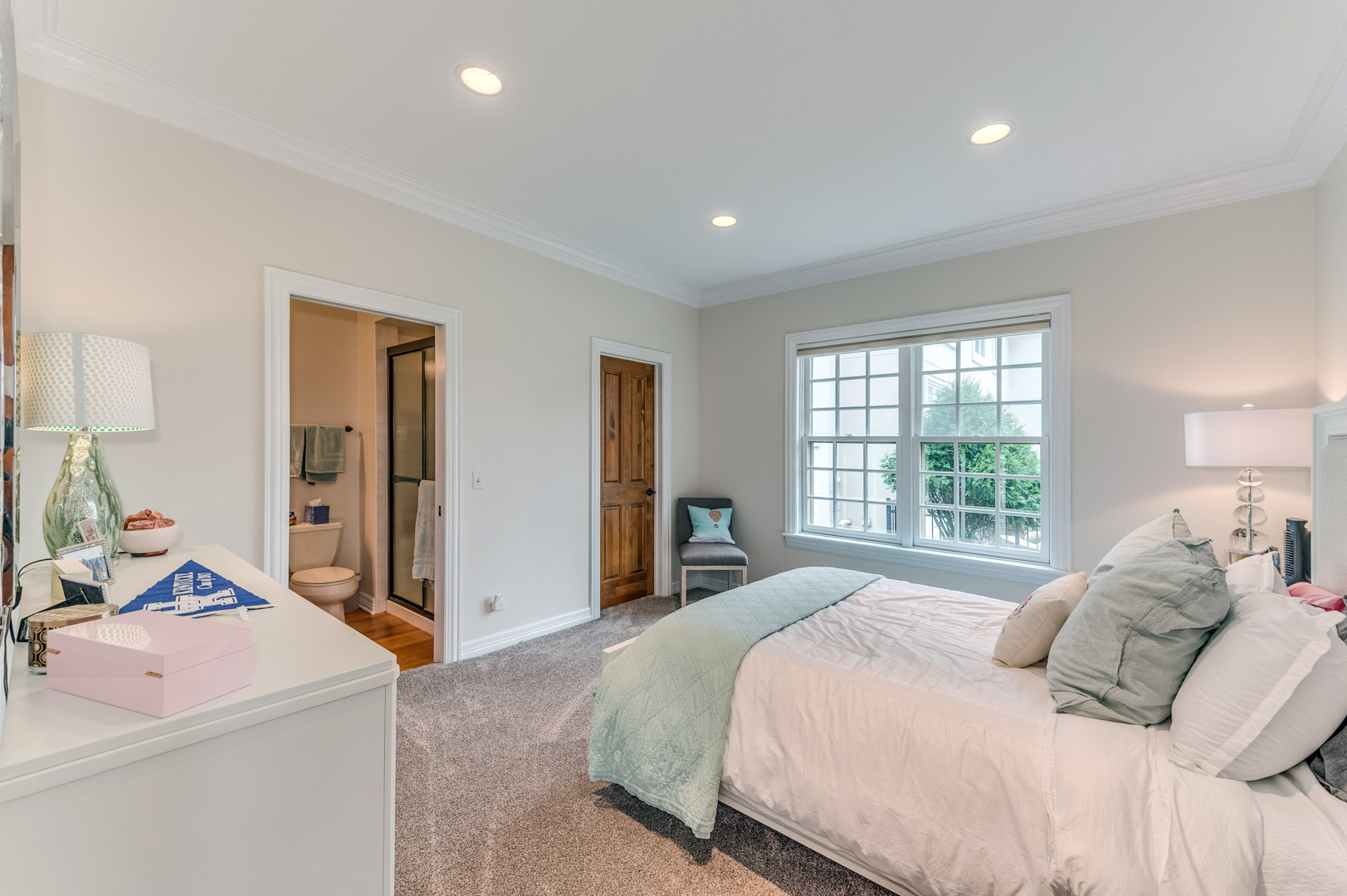 1009 Sutton Place St. Charles, IL 60174 - Photo 17 of 41 a bedroom with a large bed and a dresser