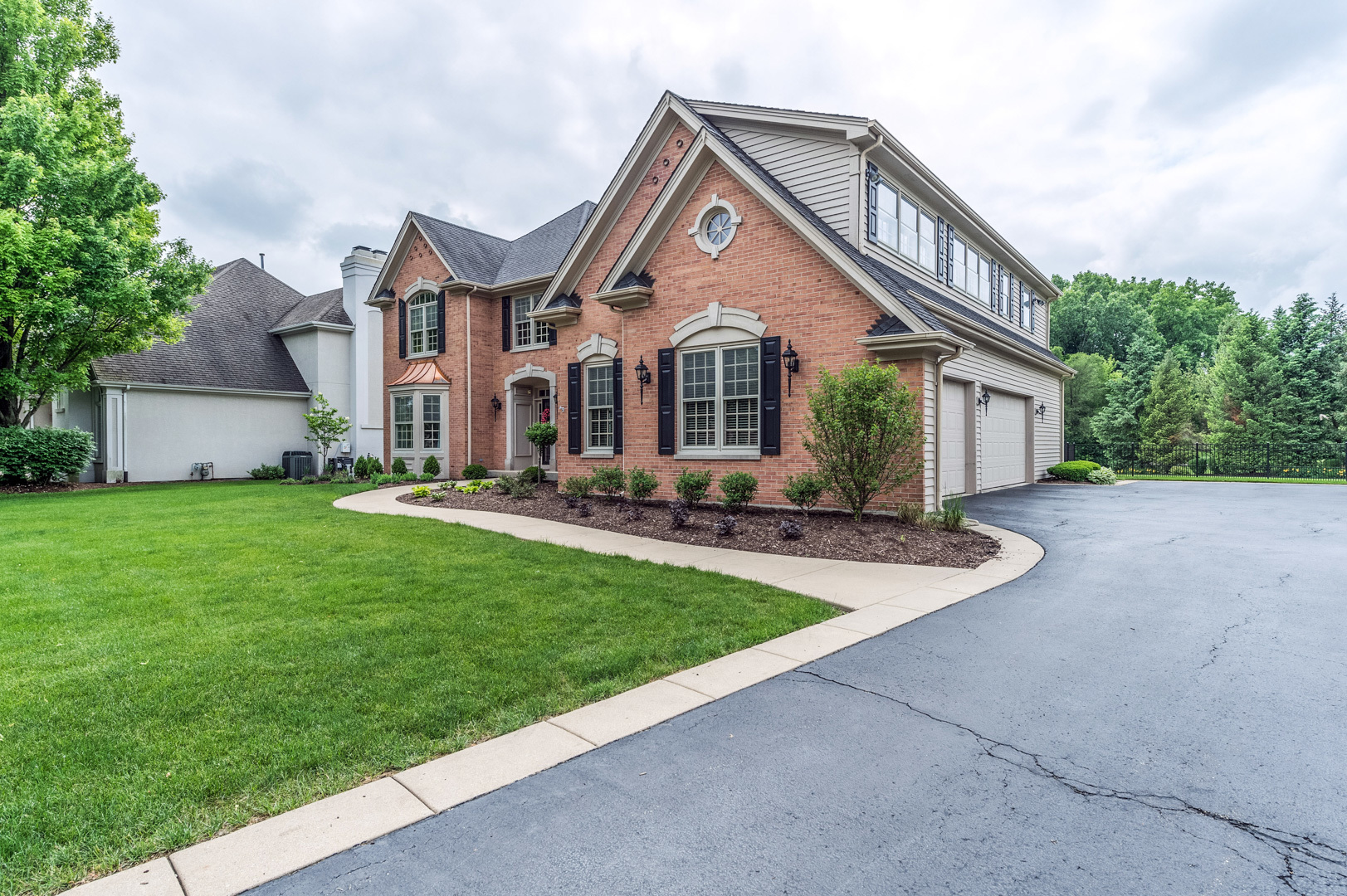 1009 Sutton Place St. Charles, IL 60174 - Photo 3 of 41 a front view of house with yard and green space